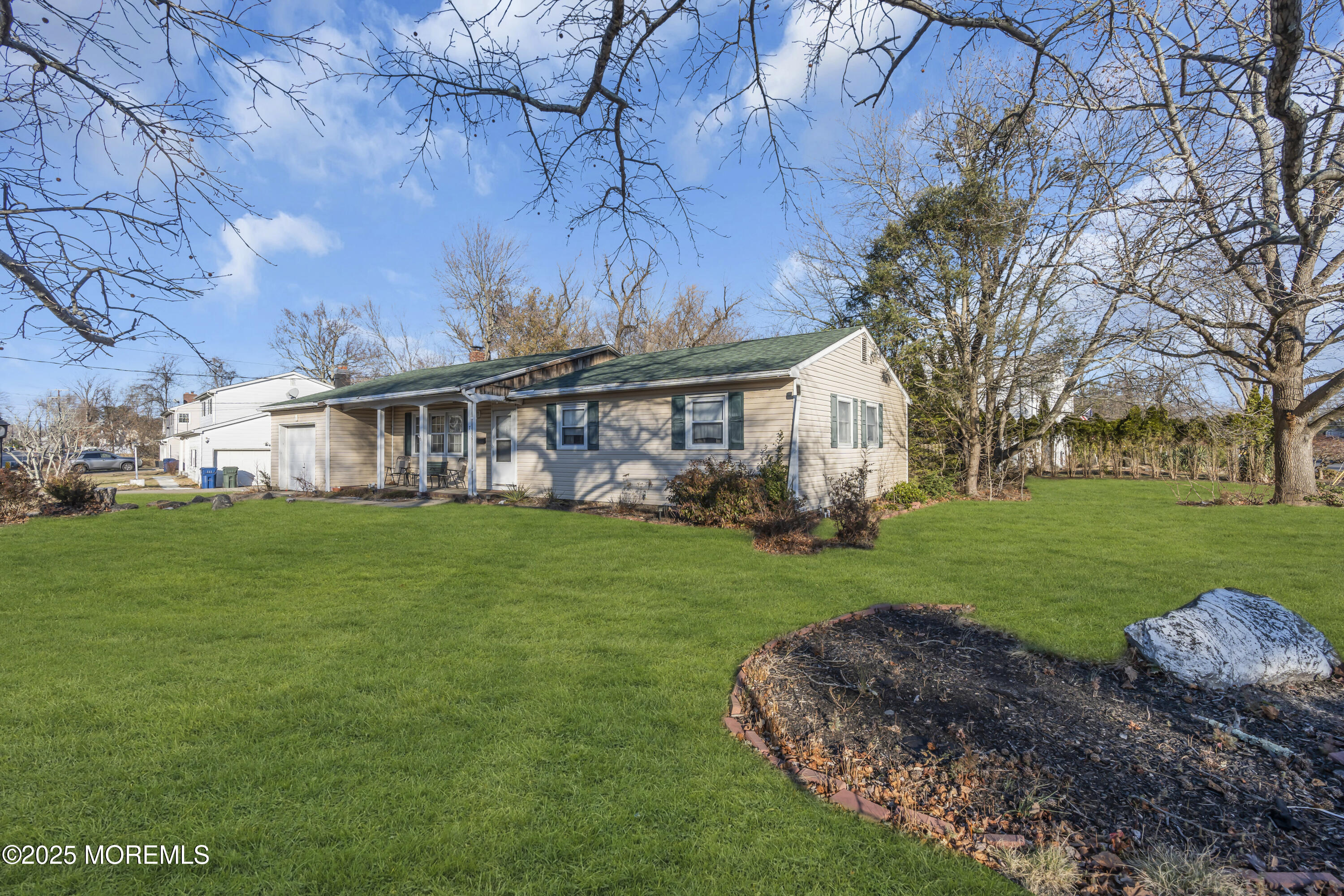 7 Whalepond Road Oakhurst, NJ 07755 - Photo 3 of 23 a view of a house with a big yard