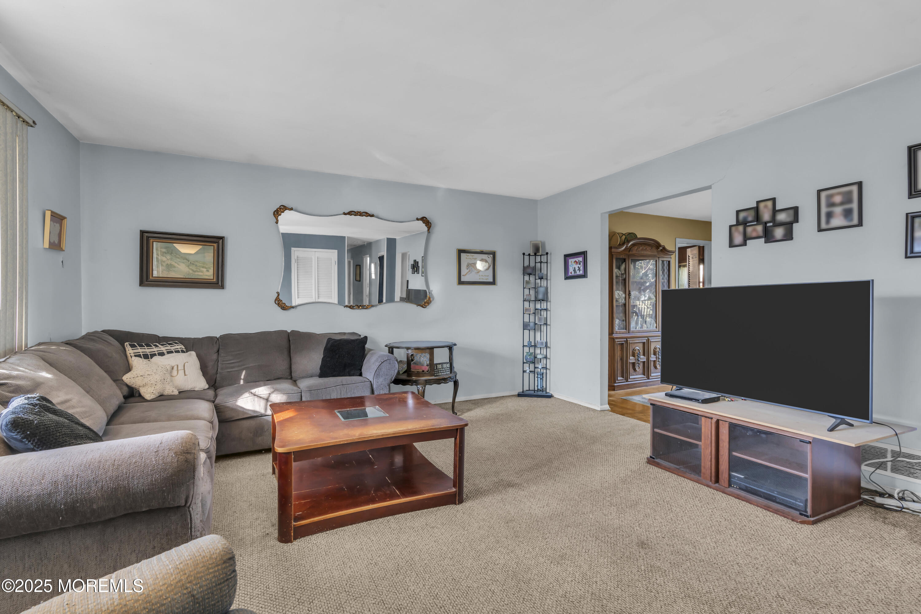 7 Whalepond Road Oakhurst, NJ 07755 - Photo 10 of 23 a living room with furniture and a flat screen tv
