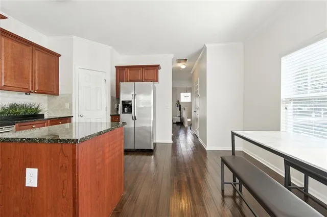 a view of a kitchen cabinets and wooden floor