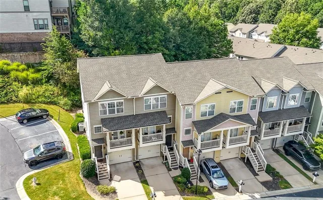 an aerial view of a house with a yard