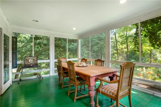 a view of a dining room with furniture window and outside view