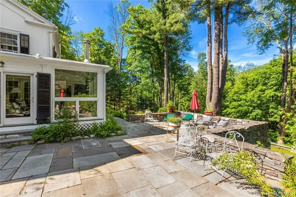 a view of a lounge chair in the front of a house