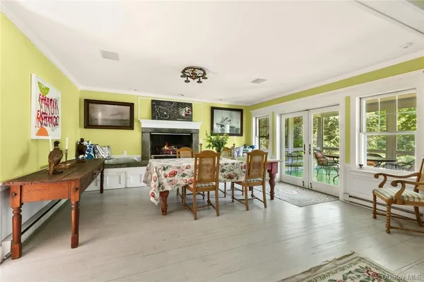 a living room with fireplace furniture and a flat screen tv