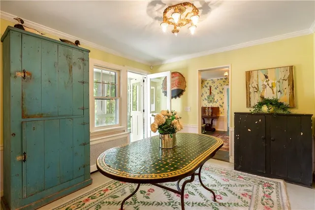 a dining room with furniture and window