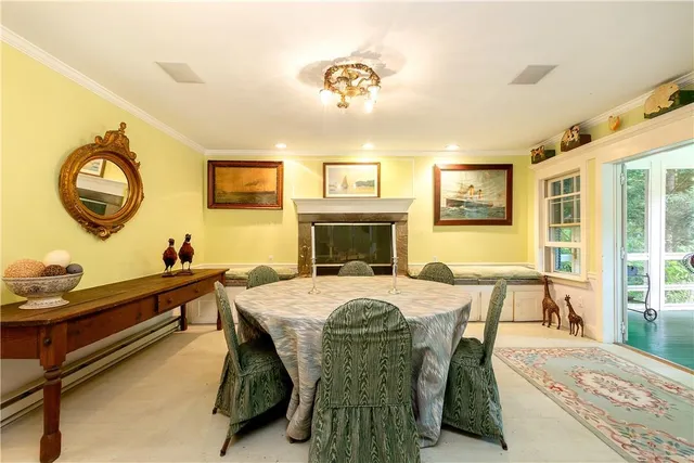 a view of a dining room with furniture and window
