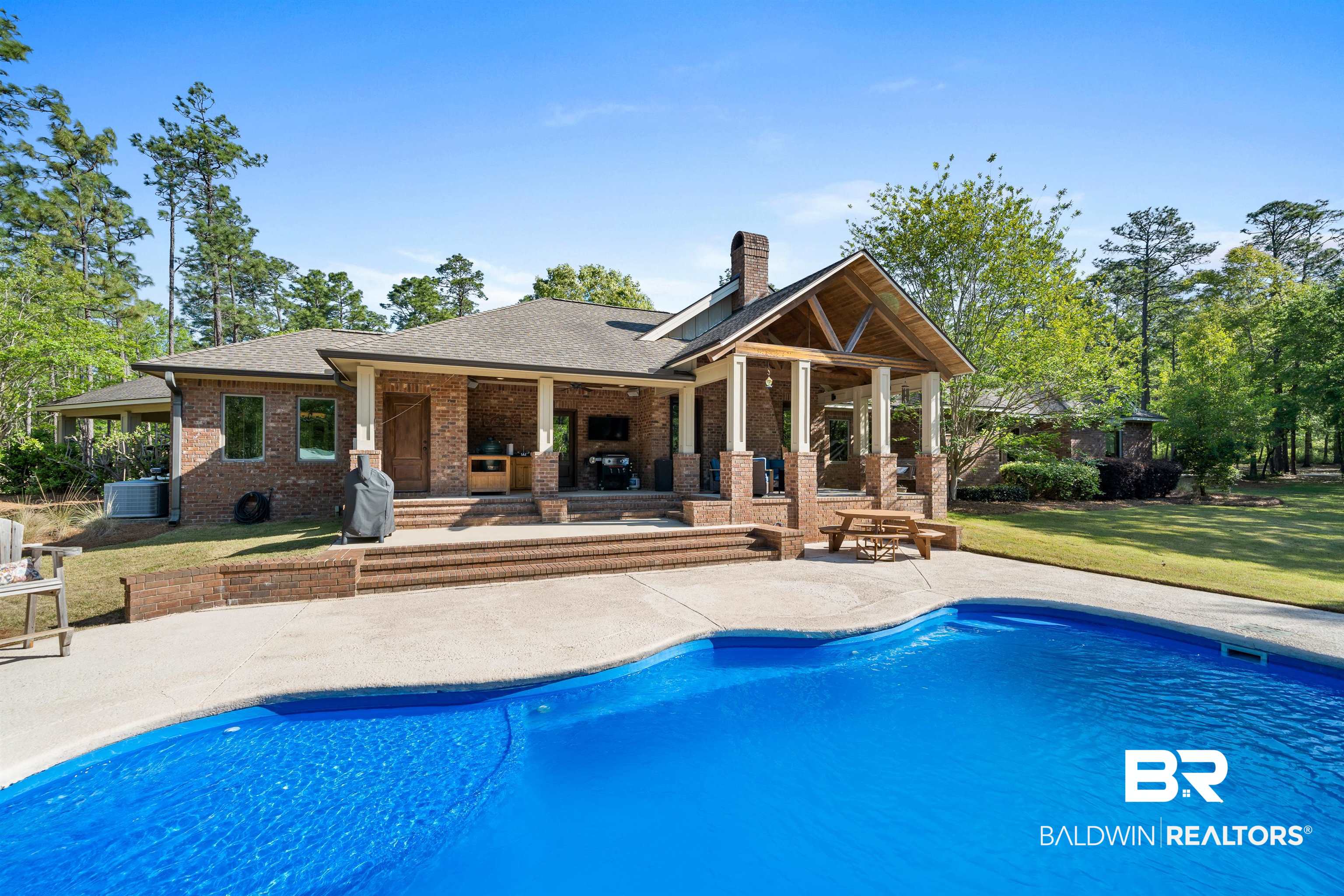 47252 Emmons Road Bay Minette, AL 36507 - Photo 39 of 50 Back of property featuring a patio, an outdoor pool, a chimney, brick siding, and a yard