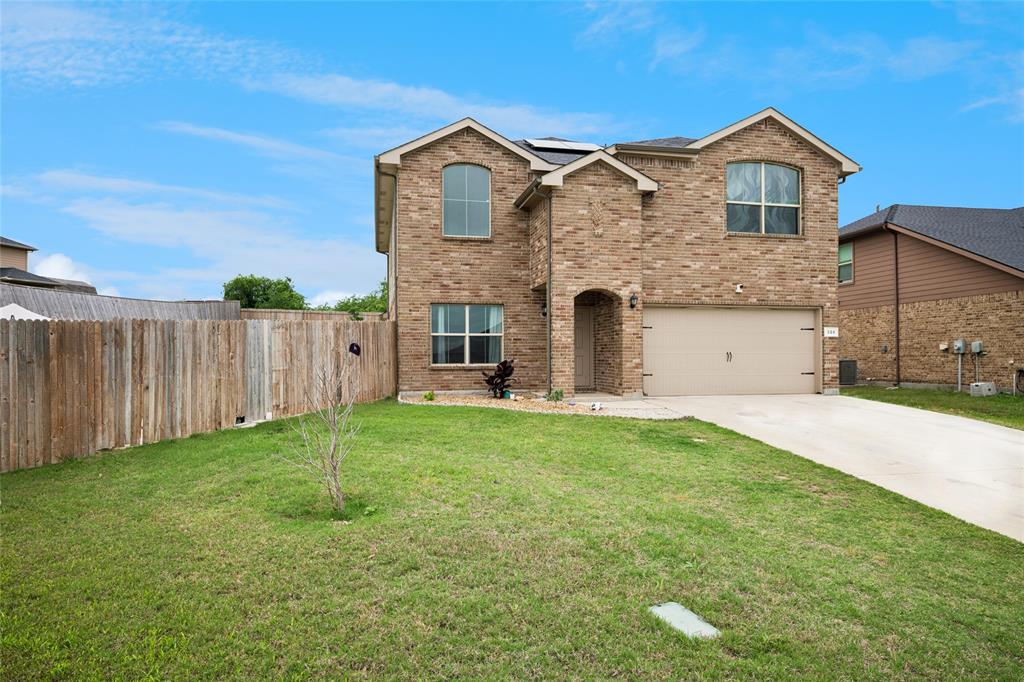 324 Fairgrounds Lane Ponder, TX 76259 - Photo 2 of 40 a front view of a house with a yard and garage