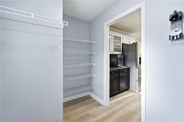 a view of kitchen and refrigerator in a kitchen