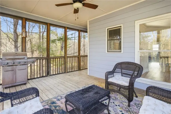 a bedroom with furniture and a window