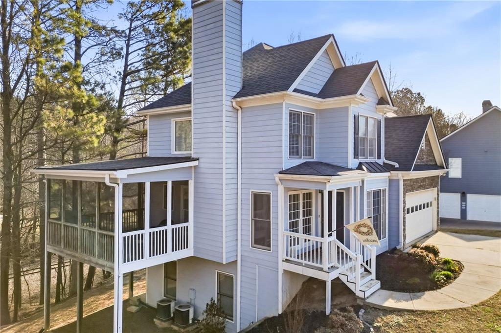 201 Arbor Hills Road North Talking Rock, GA 30175 - Photo 2 of 46 a patio with table and chairs and potted plants