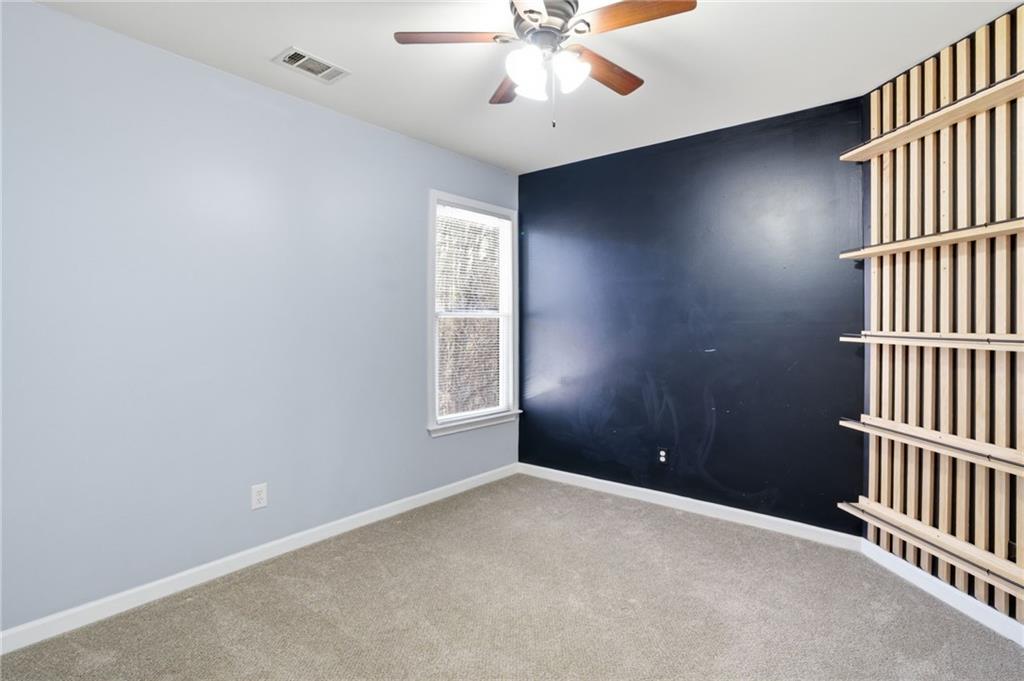 201 Arbor Hills Road North Talking Rock, GA 30175 - Photo 23 of 46 an empty room with windows and fan