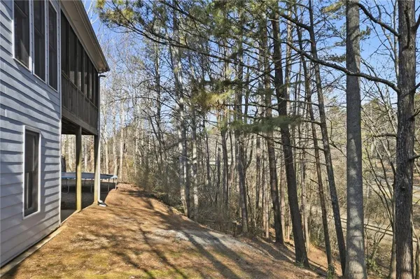aerial view of a house with yard and swimming pool