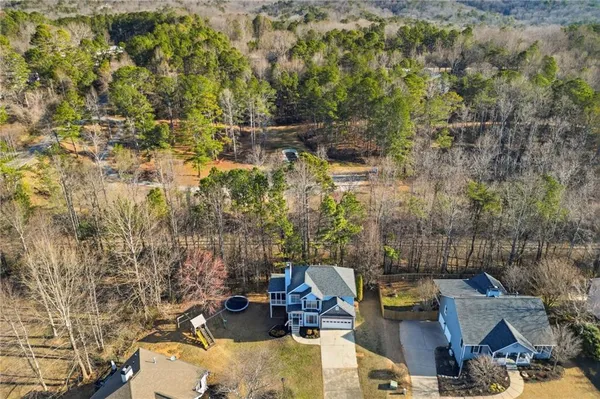 a view of a park with large trees