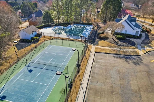 an aerial view of a house with a yard
