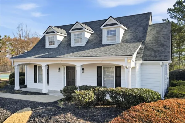 a view of a back yard of the house and car parked