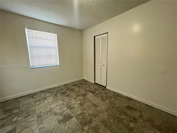 a bathroom with a bathtub and a toilet