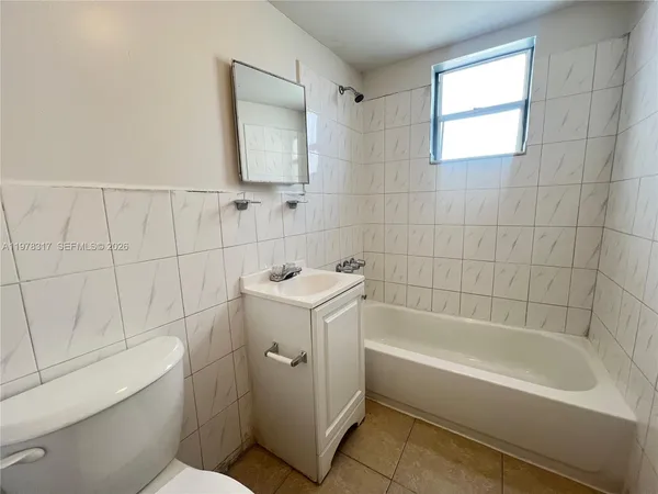a kitchen with granite countertop cabinets and sink