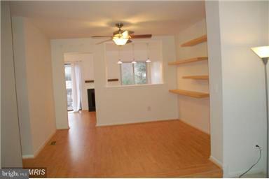 2335 Millennium Lane Reston, VA 20191 - Photo 4 of 18 a view of a room with wooden floor and chandelier