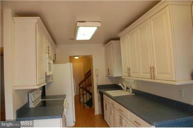 2335 Millennium Lane Reston, VA 20191 - Photo 6 of 18 a kitchen with a sink and cabinets