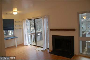 2335 Millennium Lane Reston, VA 20191 - Photo 7 of 18 a view of a livingroom with a fireplace