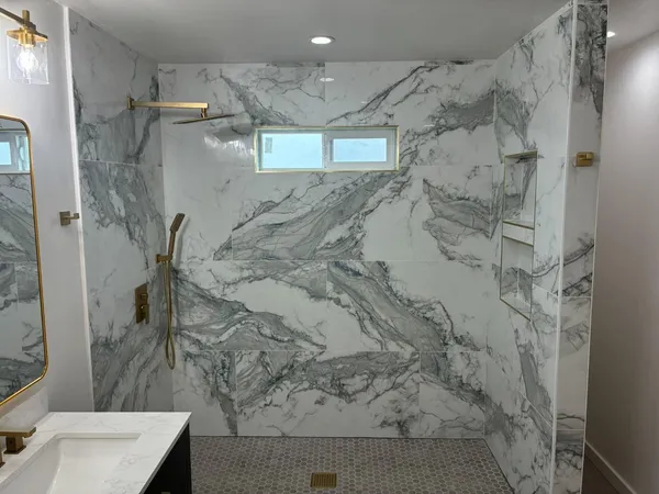 a bathroom with a shower and a sink