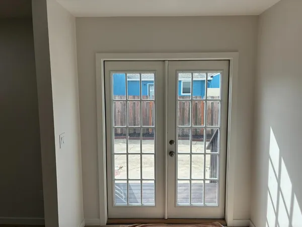 a view of a glass door and a window