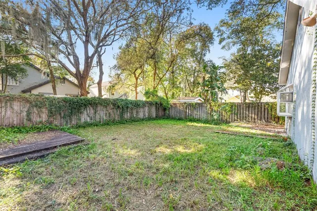a backyard of a house with lots of green space