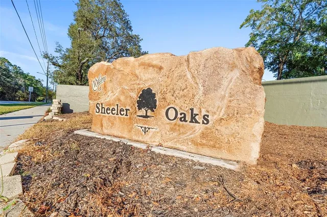 a view of outdoor space with garden and trees