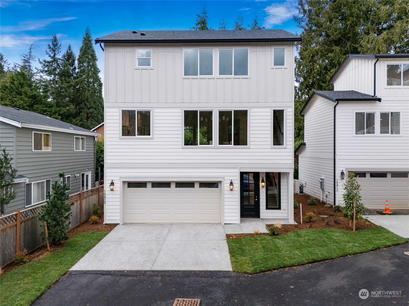 15409 50th Place West Edmonds, WA 98026 - Photo 1 of 1 a front view of a house with a yard and garage