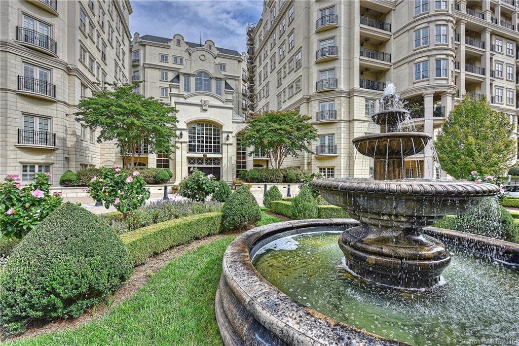2823 Providence Road, Unit 228 Charlotte, NC 28211 - Photo 1 of 24 a view of a tall building with a garden and plants