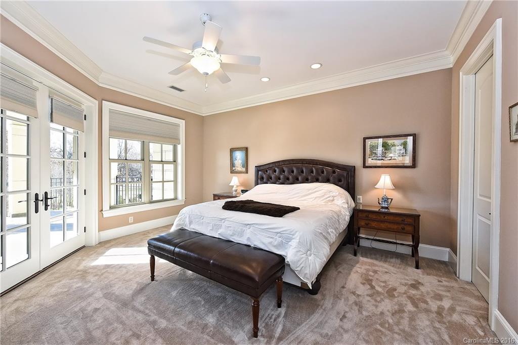 2823 Providence Road, Unit 228 Charlotte, NC 28211 - Photo 13 of 24 a spacious bedroom with a bed and a large window