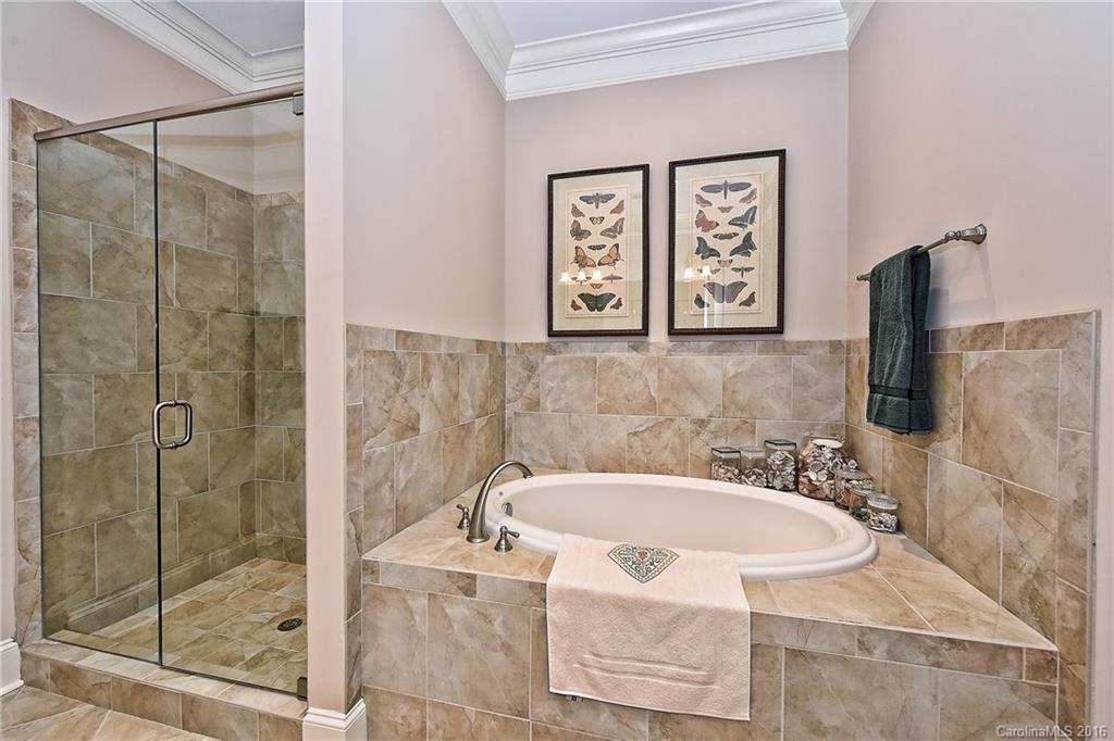 2823 Providence Road, Unit 228 Charlotte, NC 28211 - Photo 16 of 24 a bathroom with a bathtub and shower