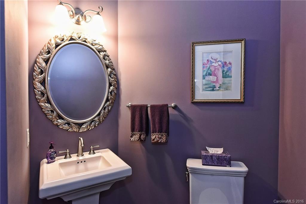 2823 Providence Road, Unit 228 Charlotte, NC 28211 - Photo 22 of 24 a bathroom with a toilet and mirror