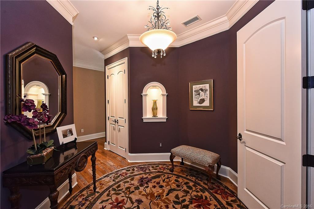 2823 Providence Road, Unit 228 Charlotte, NC 28211 - Photo 4 of 24 a bedroom with a bed and a mirror