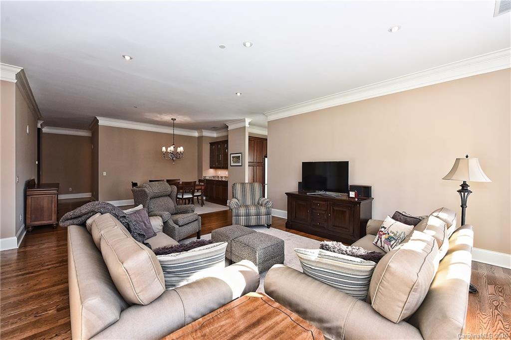 2823 Providence Road, Unit 228 Charlotte, NC 28211 - Photo 9 of 24 a living room with furniture and a flat screen tv