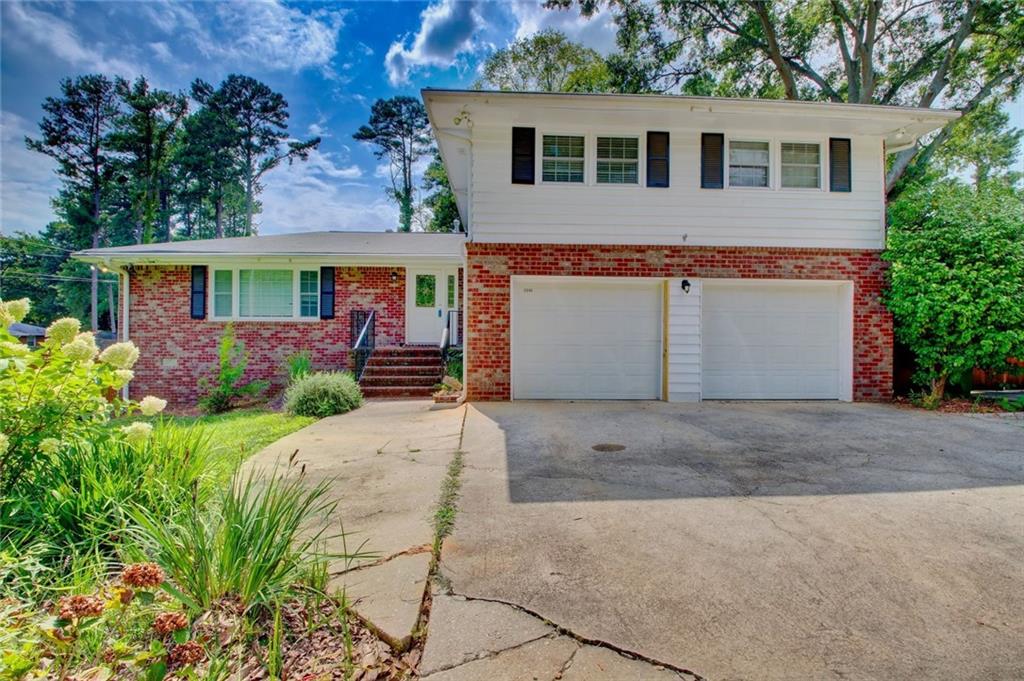 3946 Evans Road Atlanta, GA 30340 - Photo 1 of 1 front view of house with a yard