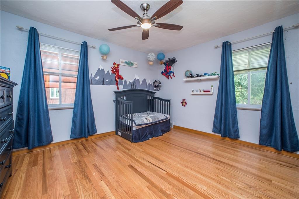 349 Thompson Run Road Pittsburgh, PA 15237 - Photo 13 of 22 a bed room with a bed and a window
