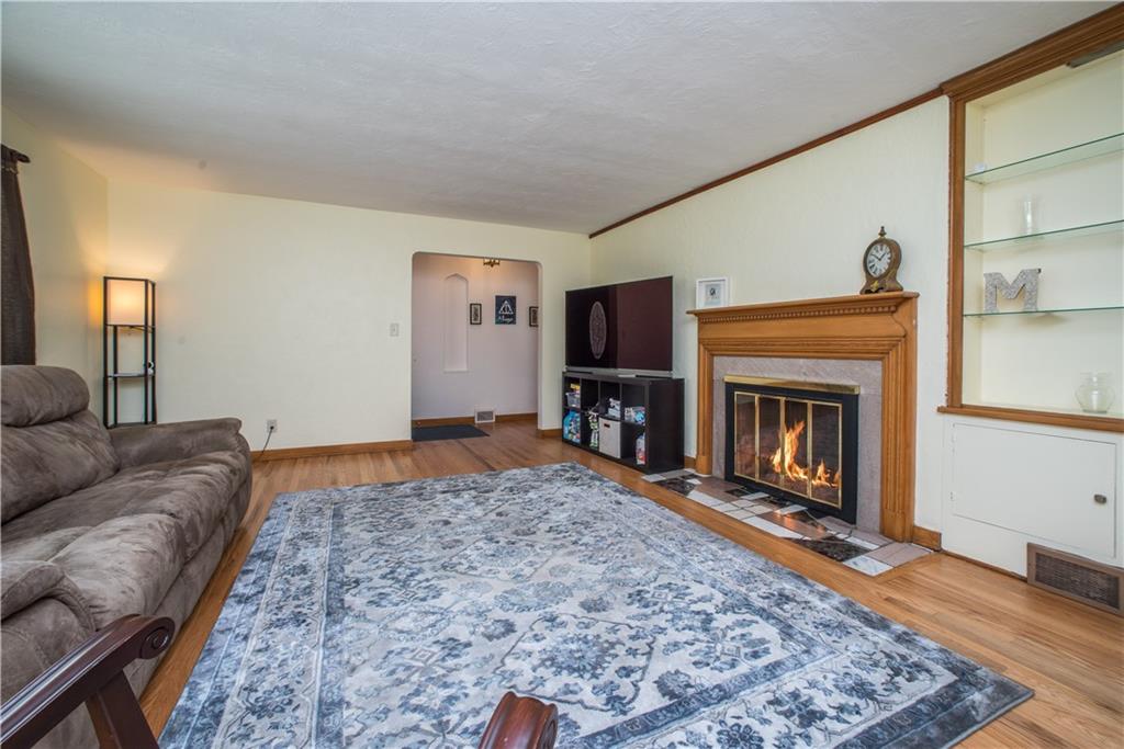 349 Thompson Run Road Pittsburgh, PA 15237 - Photo 3 of 22 a living room with a couch and a fireplace