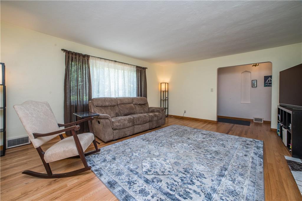 349 Thompson Run Road Pittsburgh, PA 15237 - Photo 4 of 22 a living room with furniture and a flat screen tv