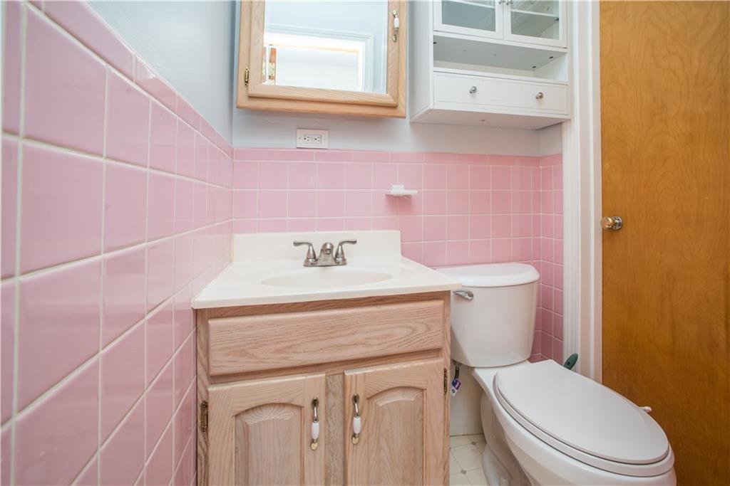 349 Thompson Run Road Pittsburgh, PA 15237 - Photo 9 of 22 a white toilet sitting next to a bathroom sink