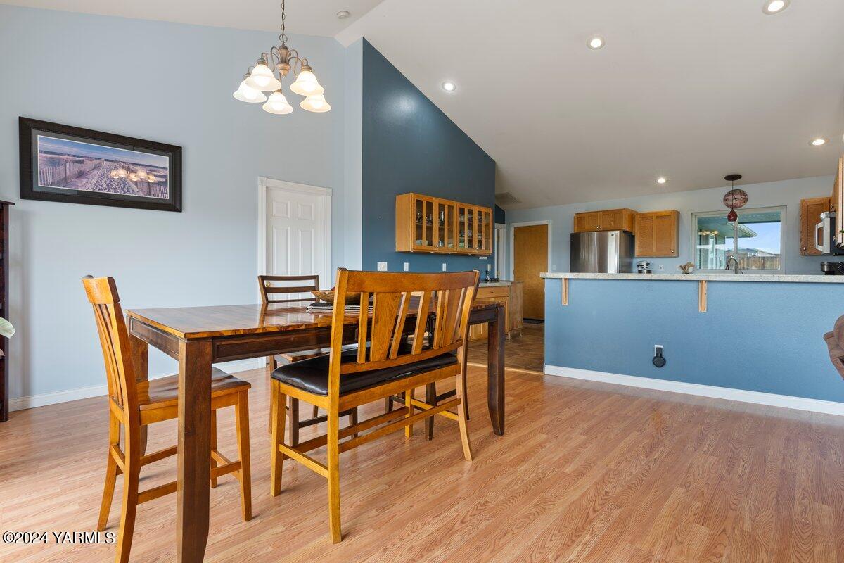 1084 Thompson Road Cowiche, WA 98923 - Photo 4 of 21 a view of a dining room with furniture and wooden floor