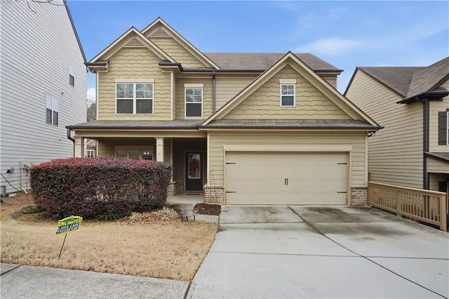 a front view of a house with a garage