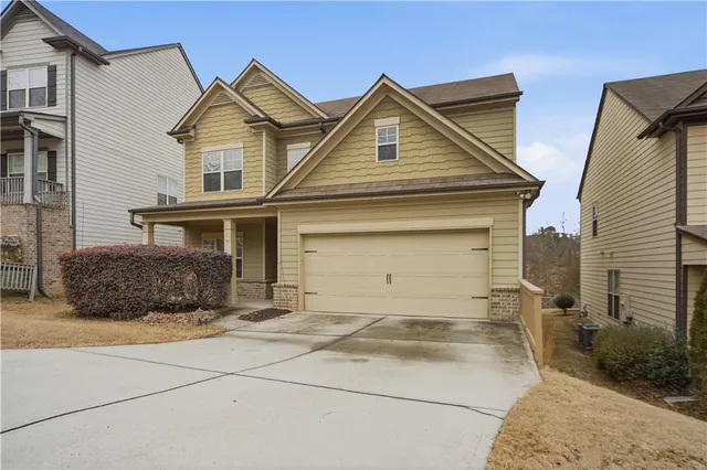 a view of an entryway with wooden floor and windows