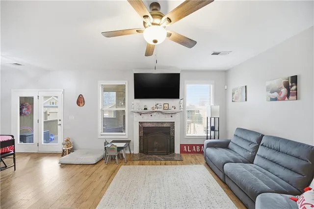 a en suite bathroom with a granite countertop sink and a mirror