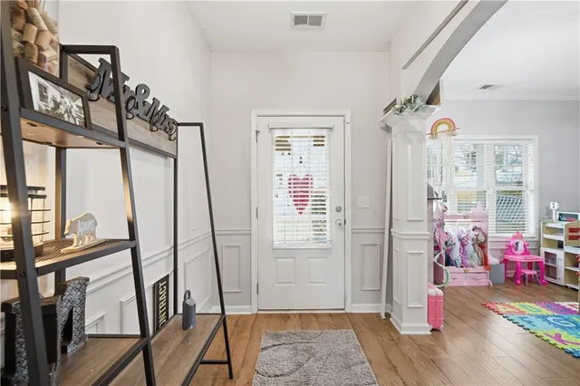 a kitchen with stainless steel appliances granite countertop a stove a sink dishwasher and cabinets with wooden floor