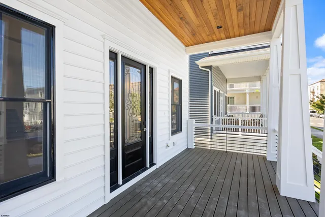 a view of a balcony with wooden floor