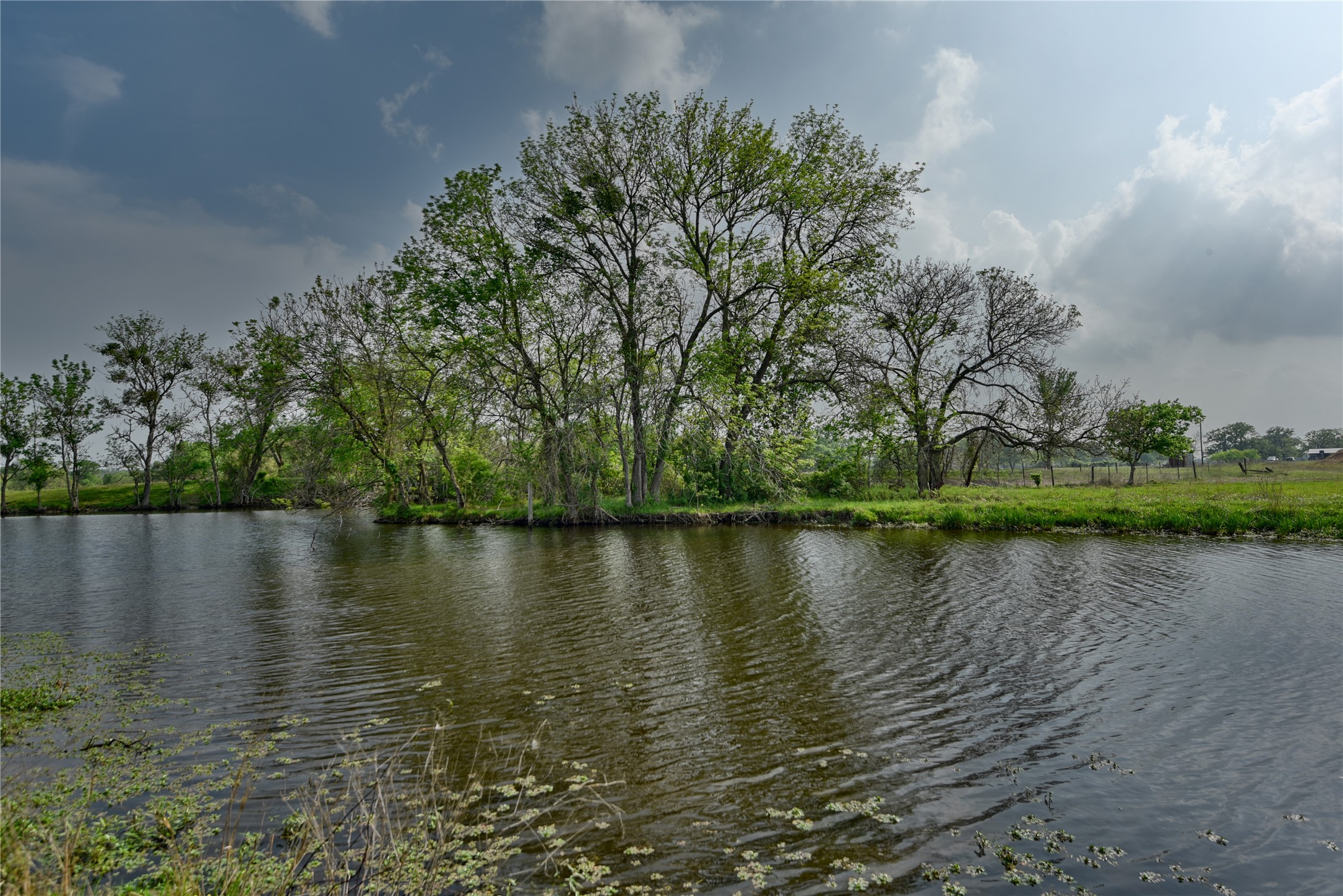 141 St Giddings Tx 78942 Giddings, TX 78942 - Photo 8 of 39 a view of a lake with houses in the back