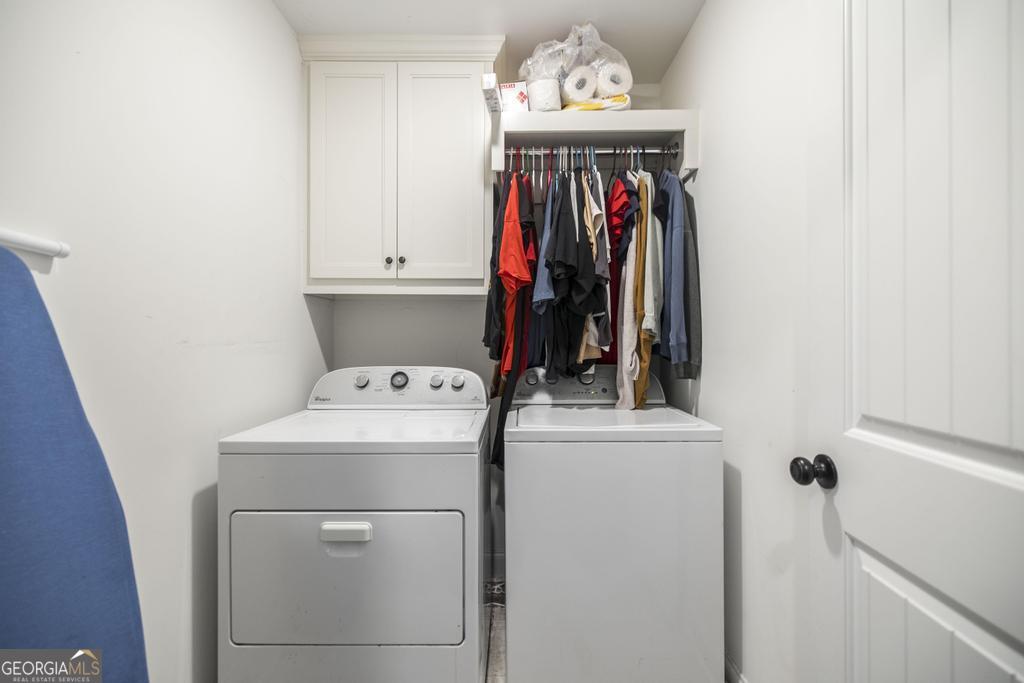 137 Sadie Heights Boulevard Perry, GA 31069 - Photo 13 of 25 a view of a hallway with washer and dryer