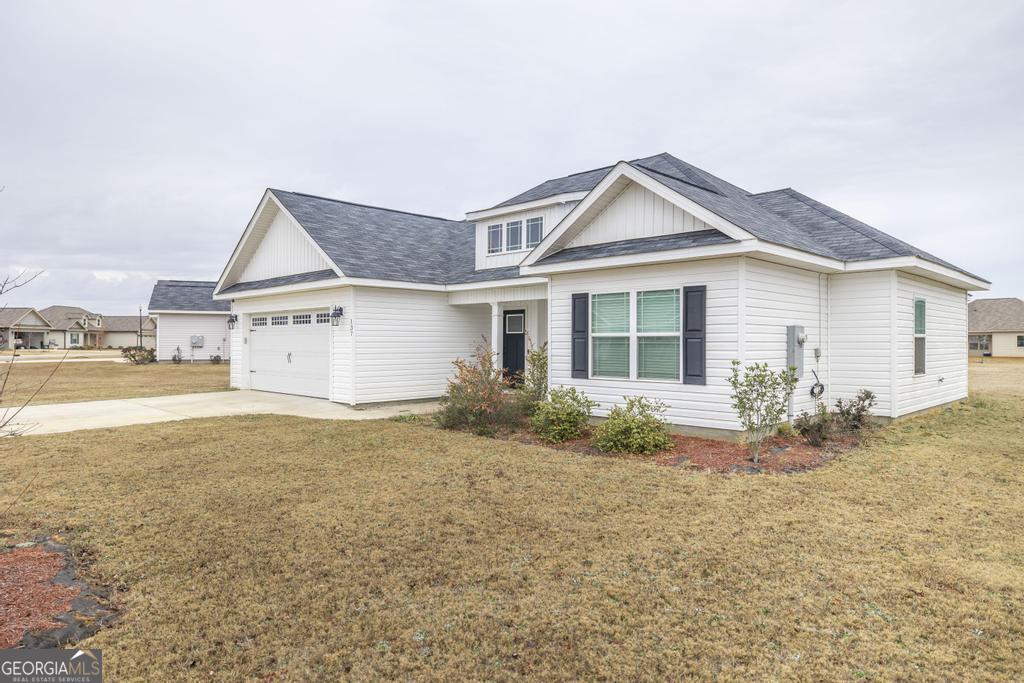 137 Sadie Heights Boulevard Perry, GA 31069 - Photo 2 of 25 a view of backyard of the house