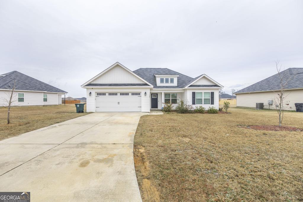 137 Sadie Heights Boulevard Perry, GA 31069 - Photo 3 of 25 a house with yard in front of it